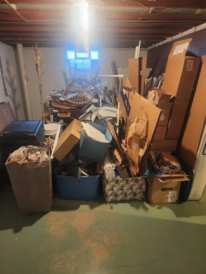 Roll-off dumpster container at job site for 15 Yard Dumpster Rental in Williston